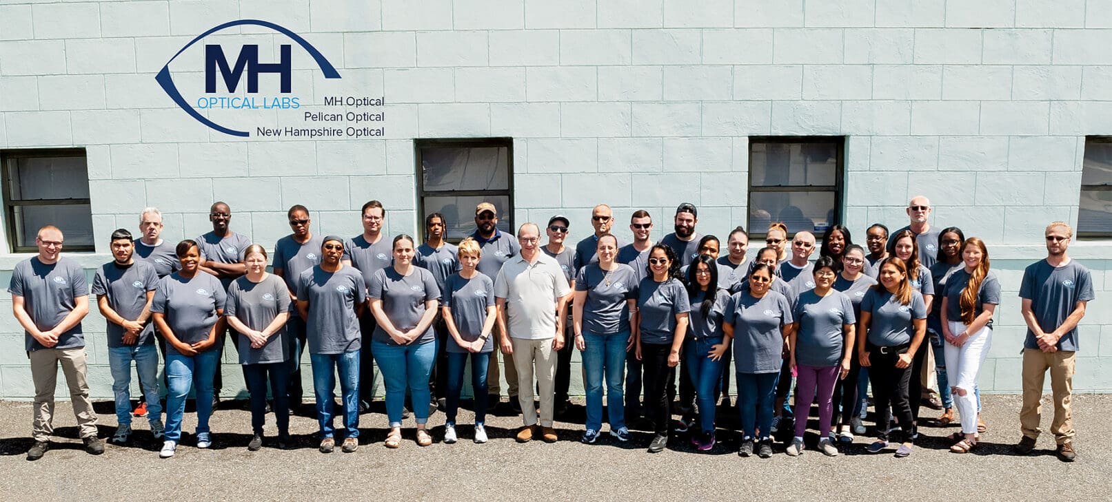 A group of people standing in front of a building.