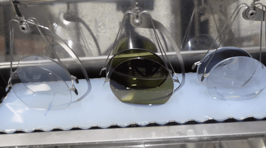 A machine that is making glasses of liquid.