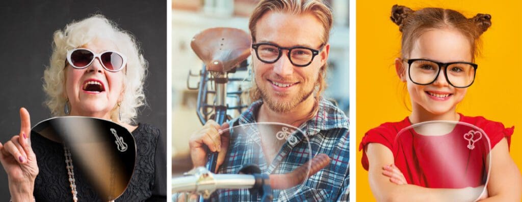 A man with long hair and glasses is holding a bicycle.